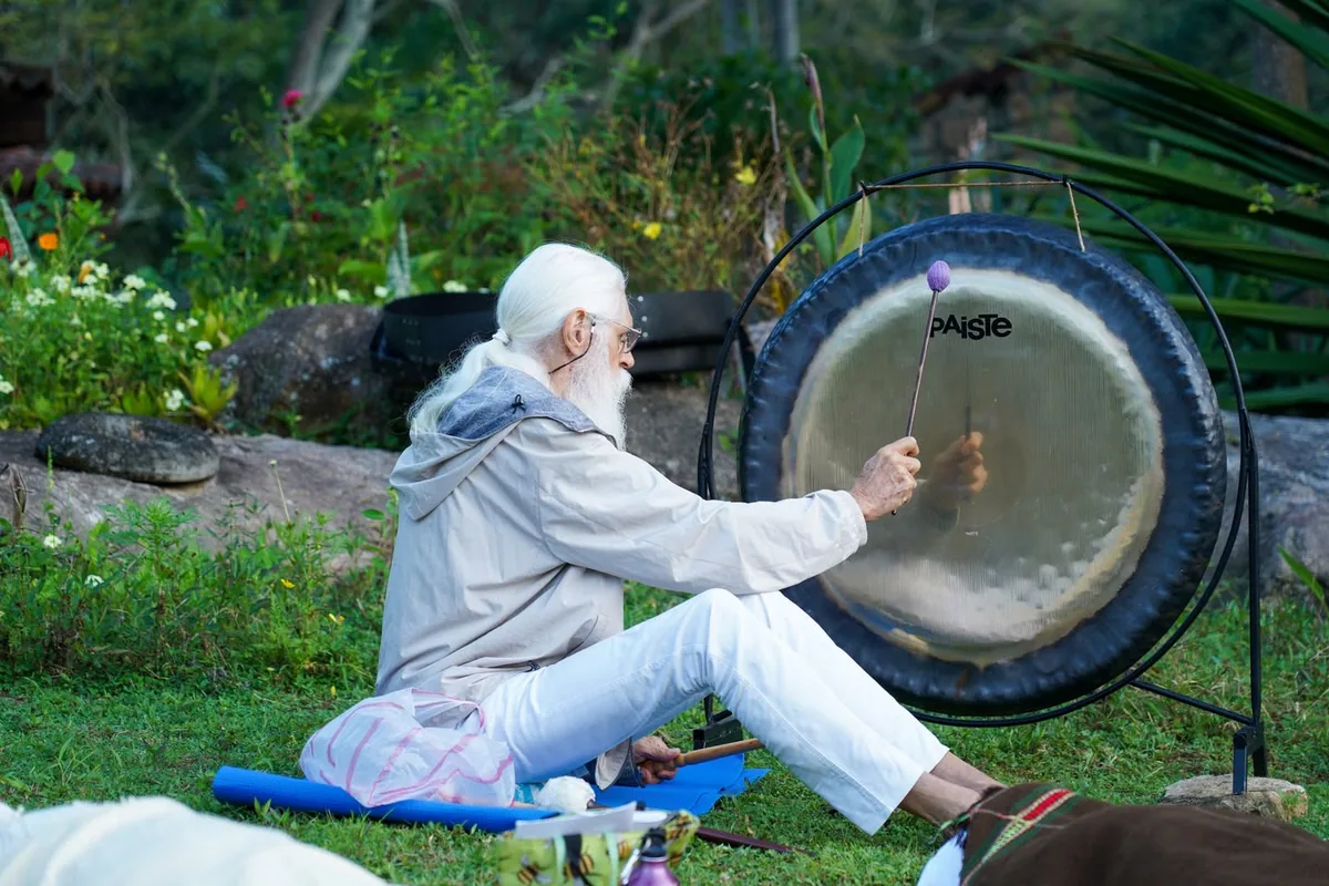 A gong being played outdoors during the Conscious Communication training
